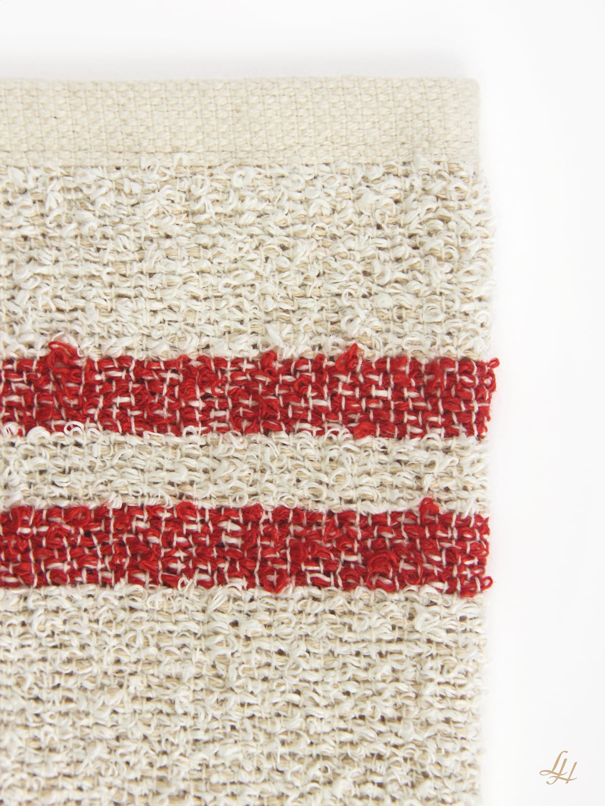 Waschhandschuh aus Leinenfrotté mit Grund Creme in Rot Detail