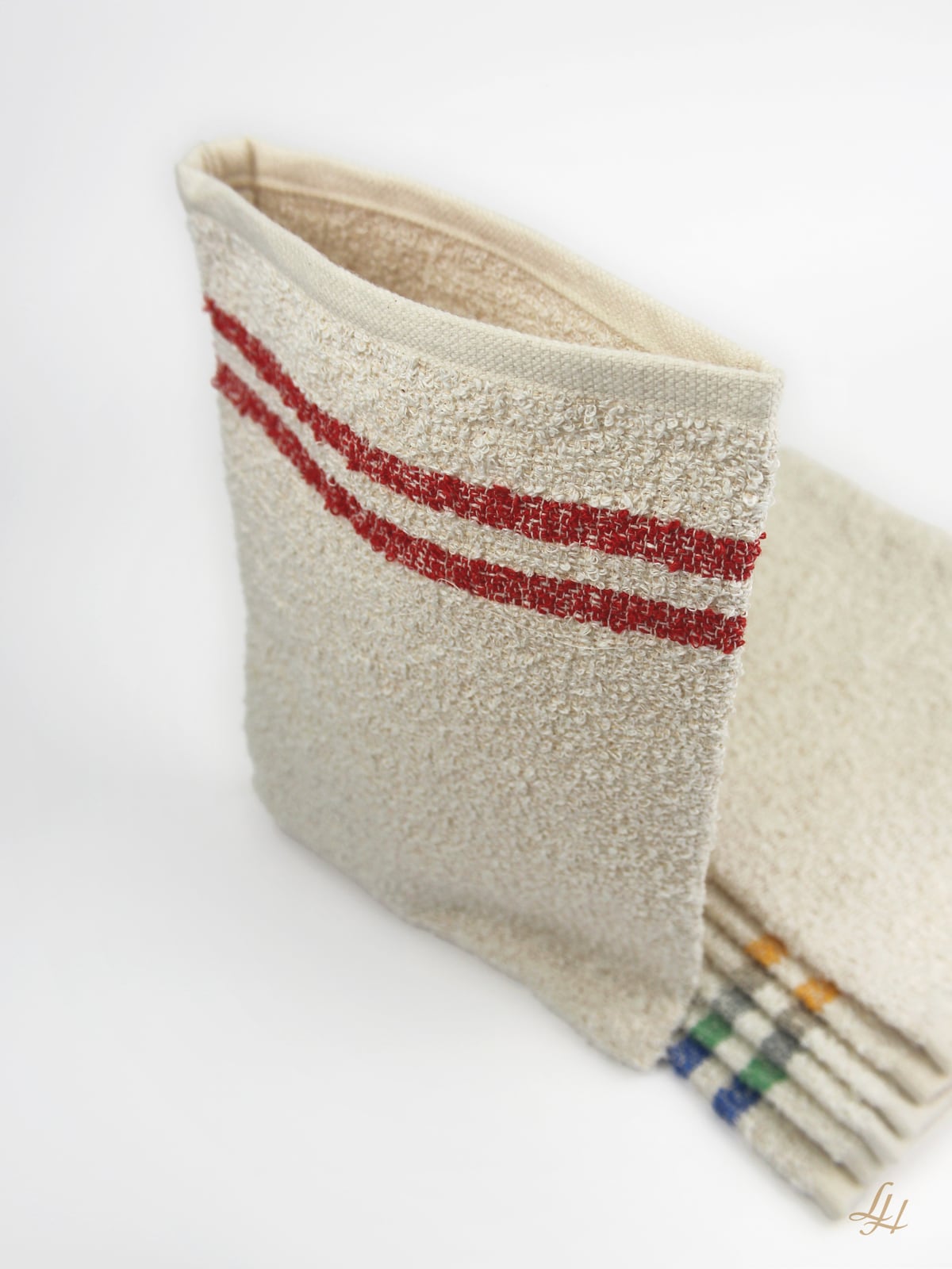 Waschhandschuh aus Leinenfrotté mit Grund Creme in Rot